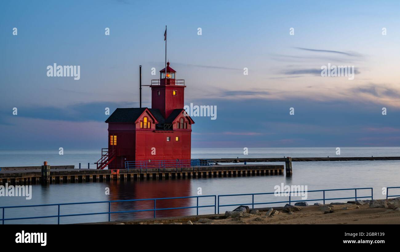 Dusk quietly settles on Holland's Big Red (a.k.a. Holland Harbor) Lighthouse, in Holland, Michigan. Stock Photo