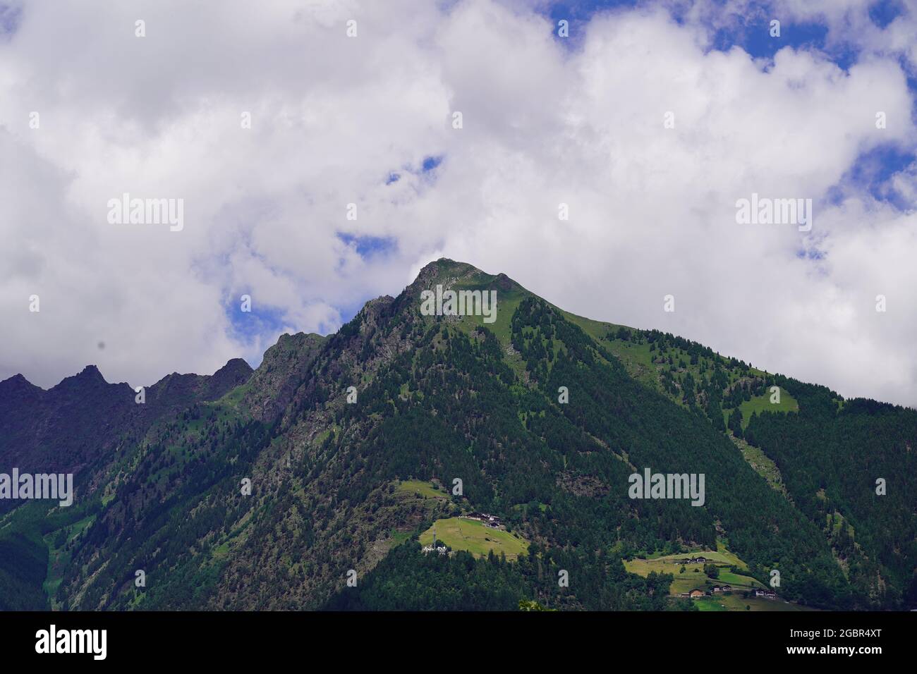 Mutter peak in South Tirol, Italy with cloudy sky in background Stock Photo