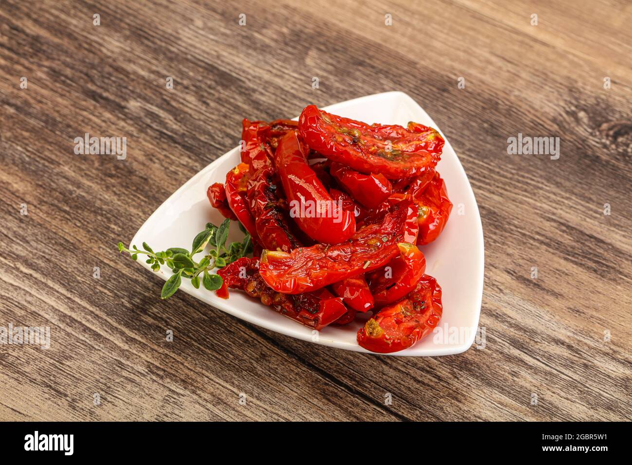 Sundried tomato in olive oil with herbs and spices Stock Photo Alamy