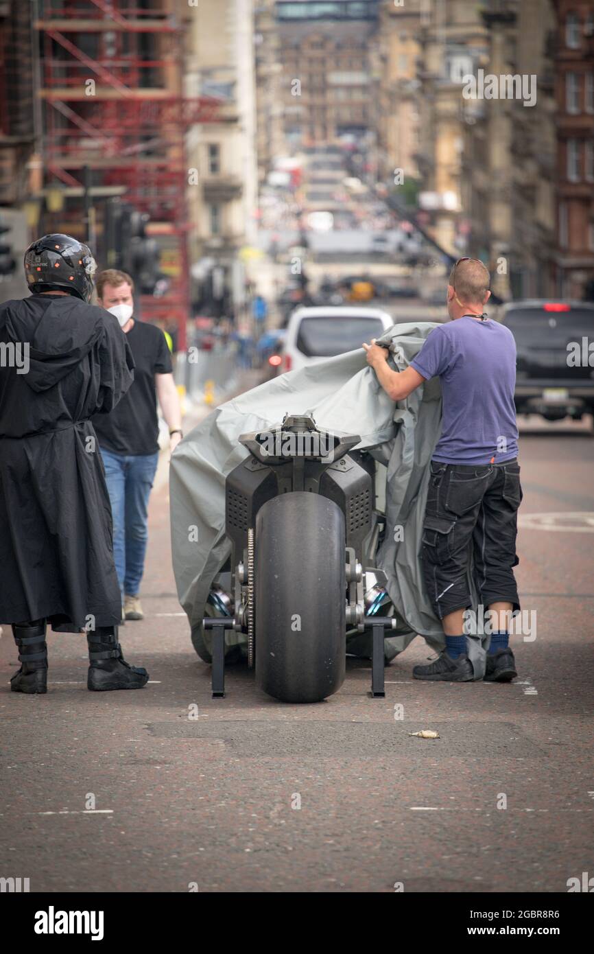 Batman in Glasgow During the Filming of The Flash in Glasgow City Centre, on the 31st July 2021. Stunt rider Rick English on the Bat Bike Stock Photo