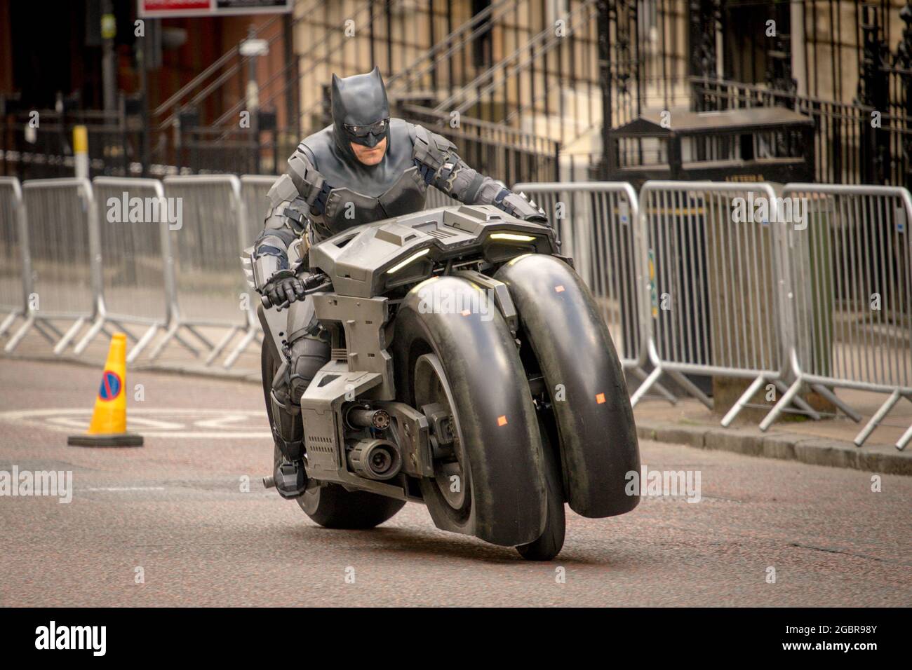 Batman in Glasgow During the Filming of The Flash in Glasgow City Centre,  on the 31st July 2021. Stunt rider Rick English on the Bat Bike Stock Photo  - Alamy