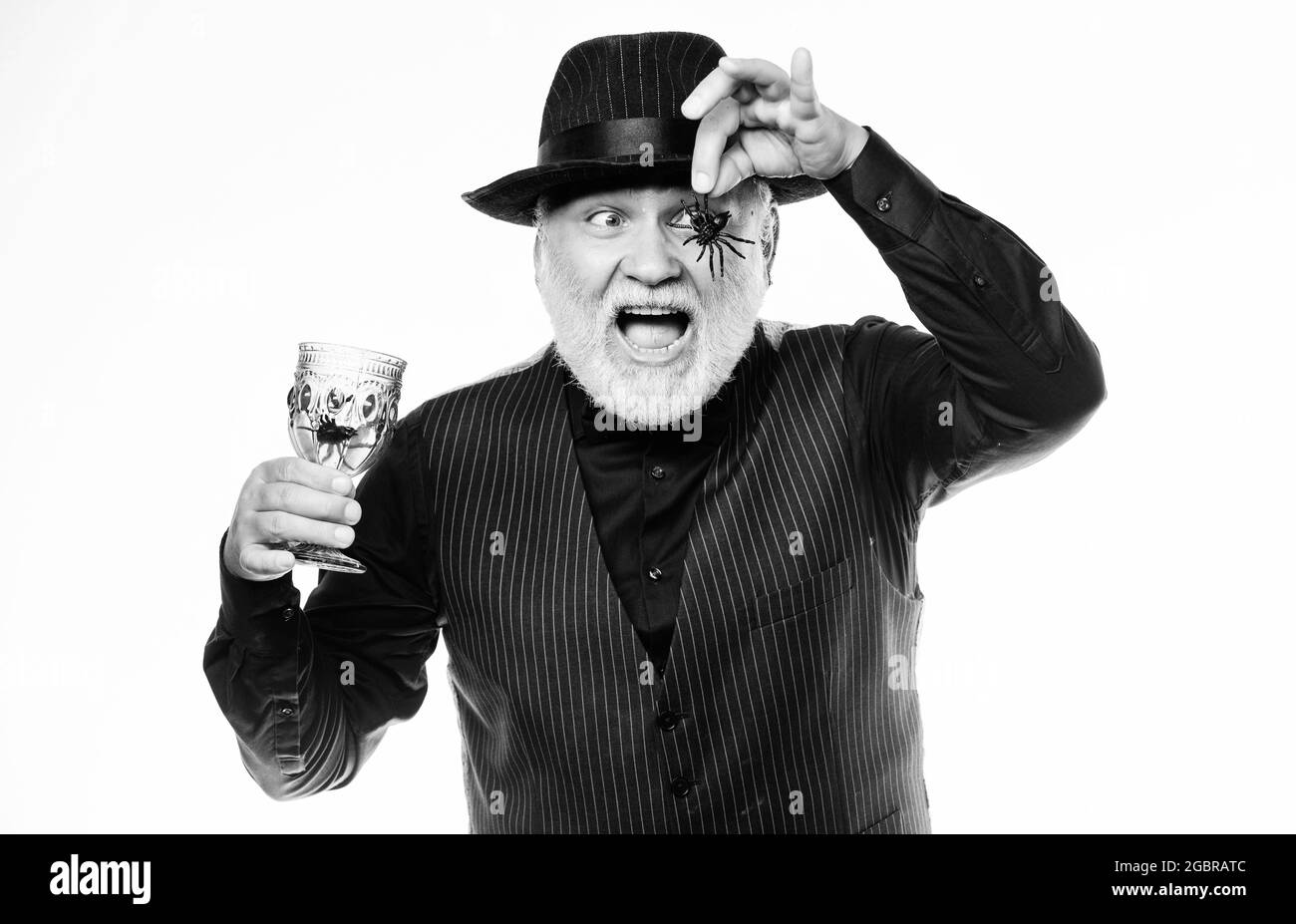 Halloween night. halloween holiday costume. barman make cocktail for halloween party. mature man magician in witch hat. happy halloween. evil wizard Stock Photo