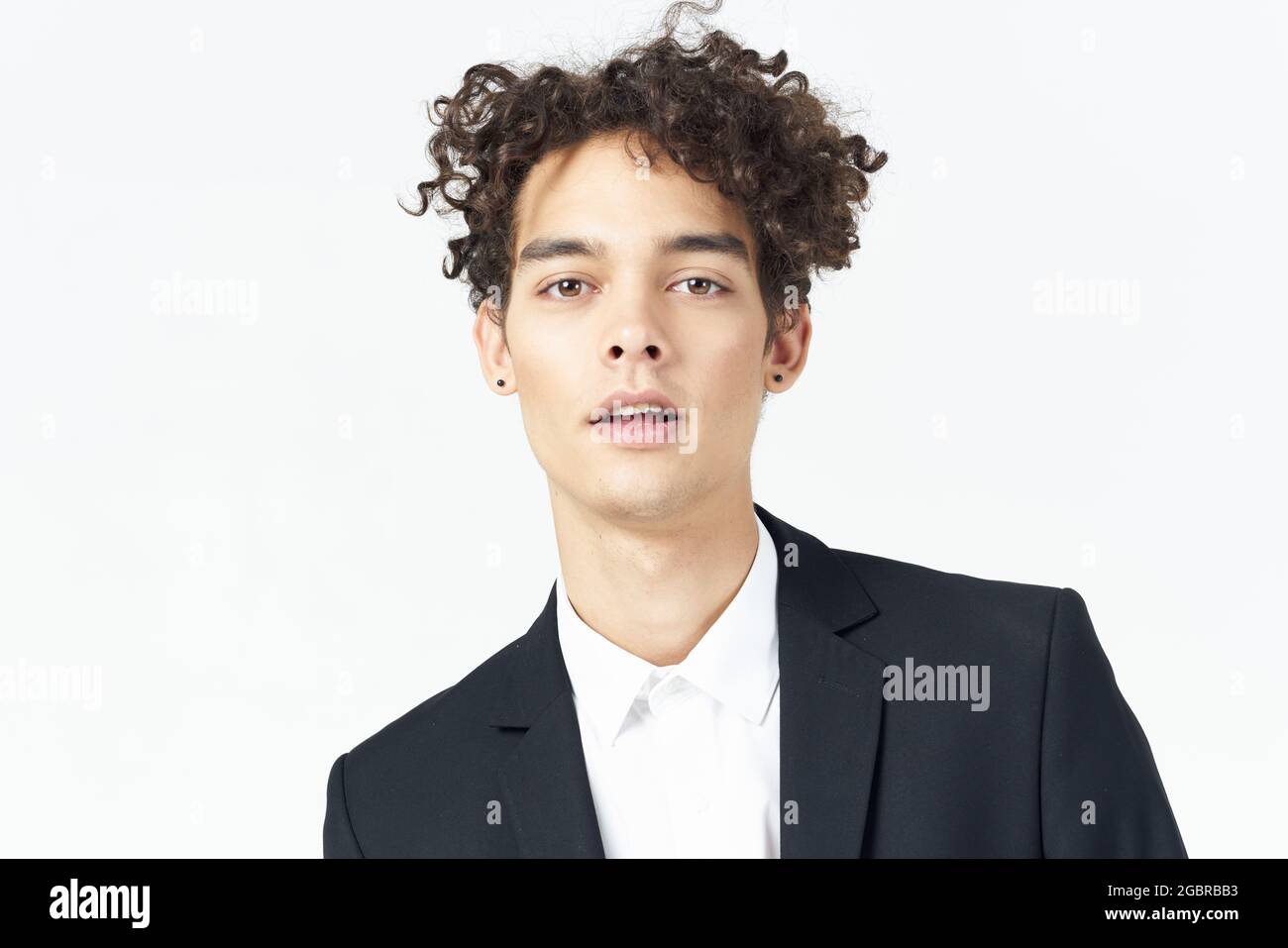 man in black suit posing on isolated background fashion Stock Photo - Alamy