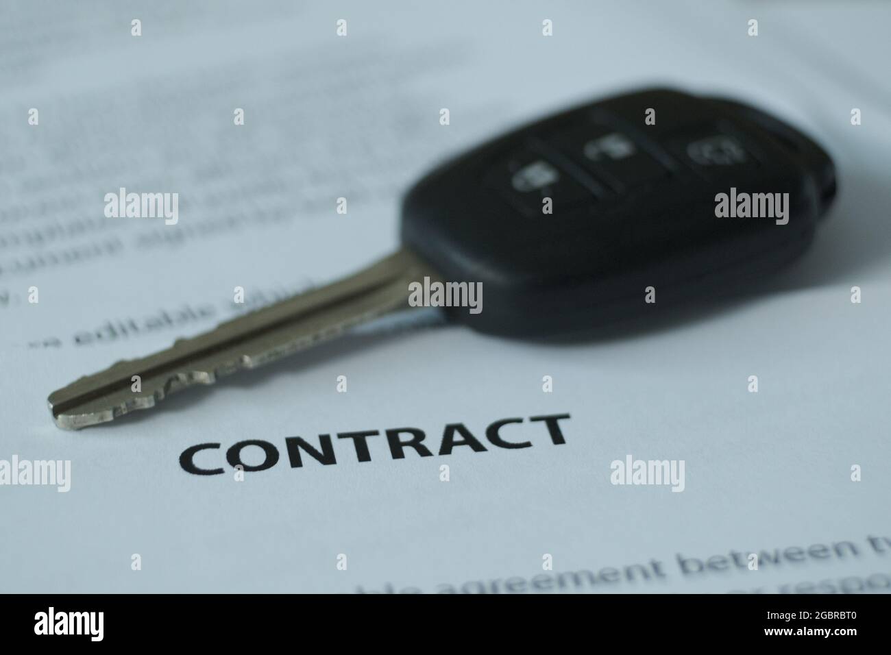 There is a contract and car keys on the table, the emphasis is on the