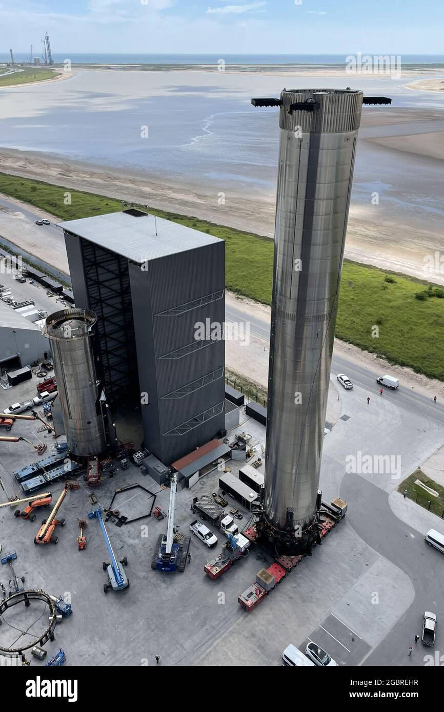 Boca Chica, United States. 05th Aug, 2021. SpaceX CEO Elon Musk shared photos show the company's Super Heavy Booster 4 as it was rolled out towards the Launch Mount at Starbase in Boca Chica, Texas, in preparation for the company's first orbital Starship launch on August 3, 2021. Photo by SpaceX/UPI Credit: UPI/Alamy Live News Stock Photo