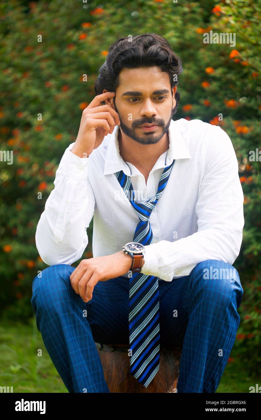 Young male model in garden Stock Photo