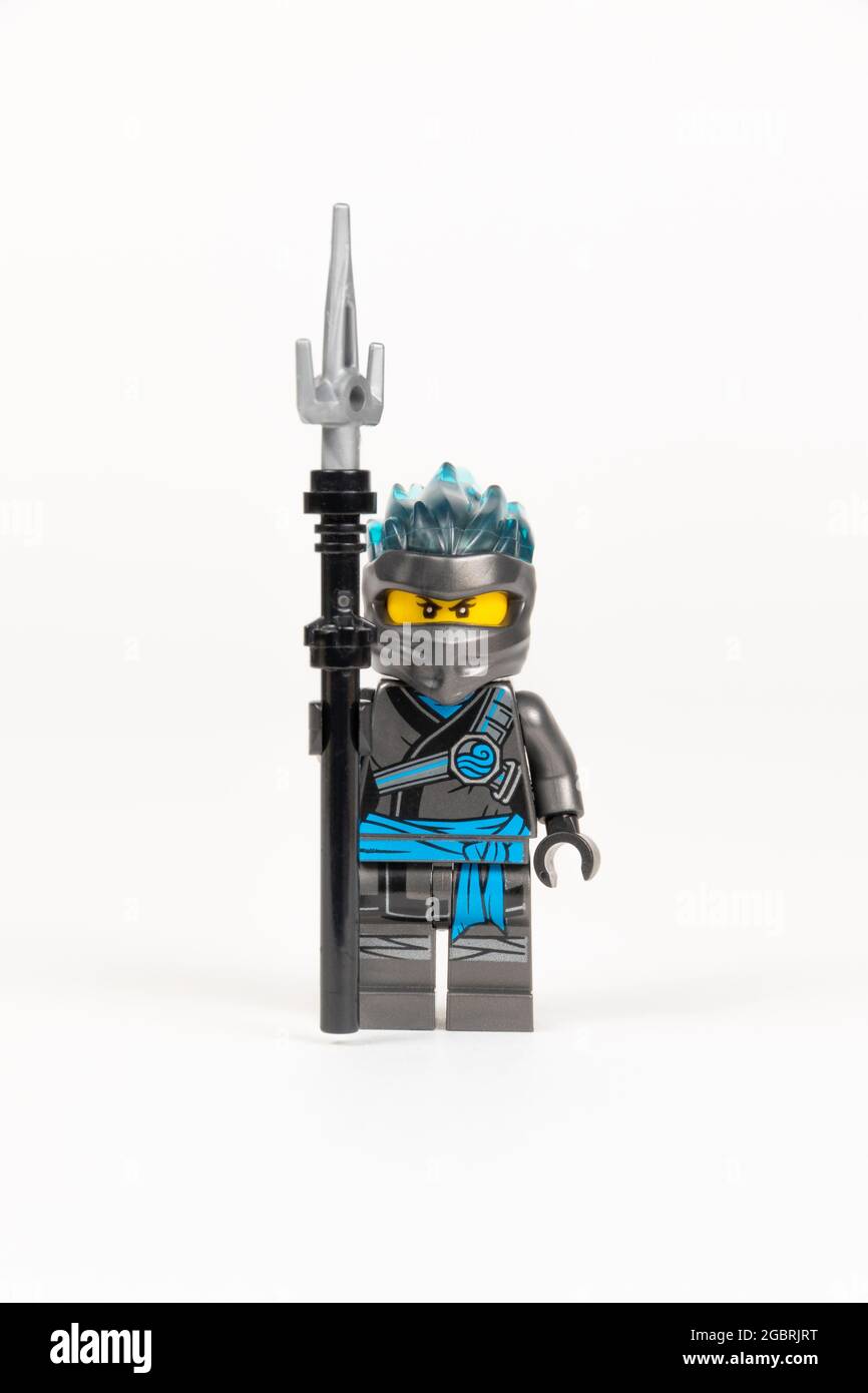 Yekaterinburg. Russia. 04.08.2021. Toy hero Nya in a gray kimono with a spear from a set of lego ninjago on a white background. close-up. selective fo Stock Photo