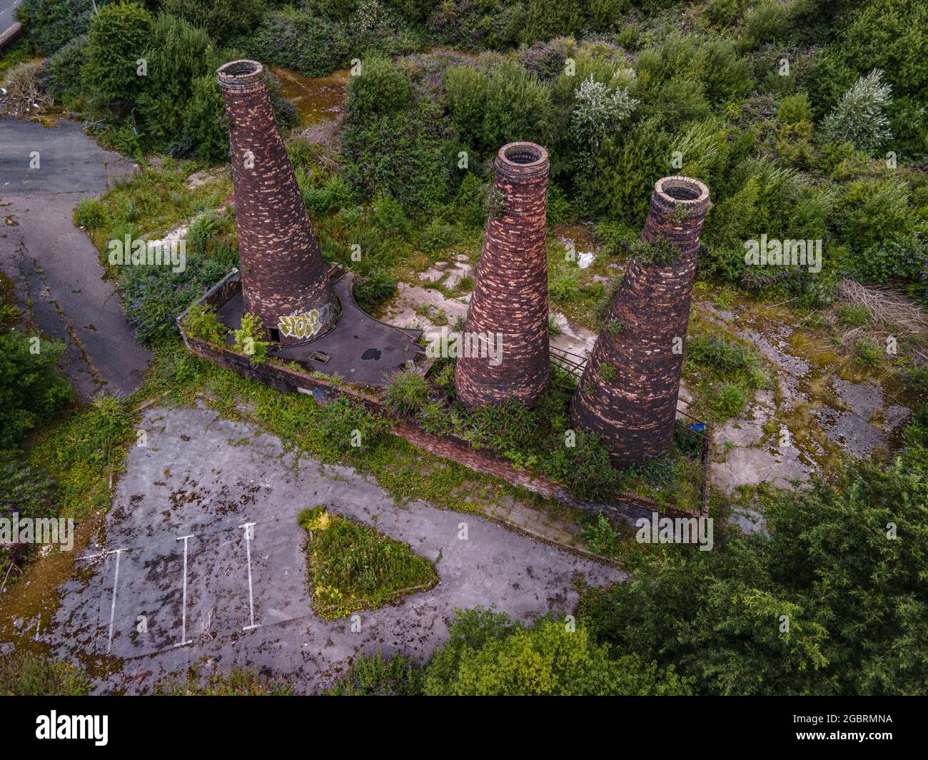 Aerial View Of Burslem Inc New Housing Development and Disused Pottery Chimneys plus Church Drone Staffordshire England Stock Photo