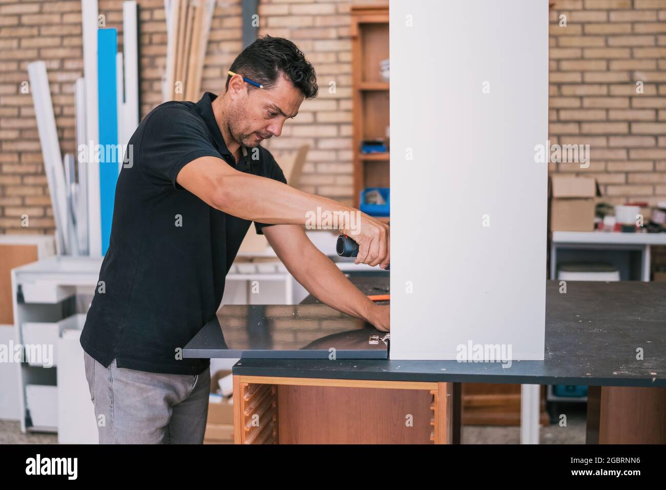 Man fixing a door with a drill Stock Photo Alamy
