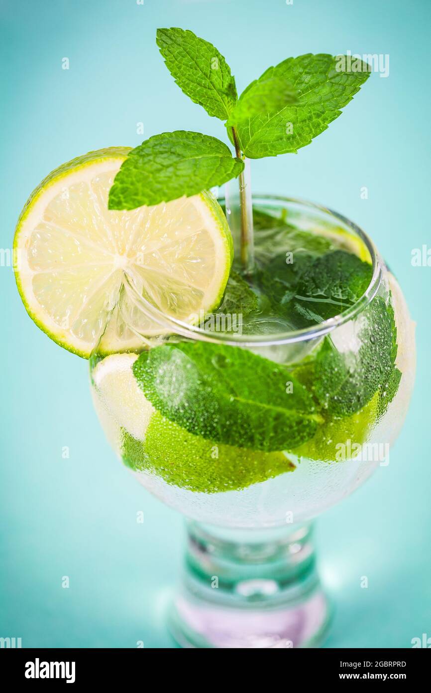 Glass of fresh mojito cocktail with ice, mint and lime Stock Photo - Alamy
