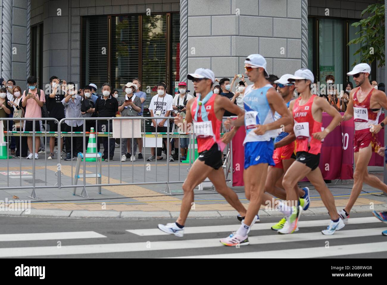 Sapporo, Japan. 5th Aug, 2021. Spectators watch the men's 20km race ...