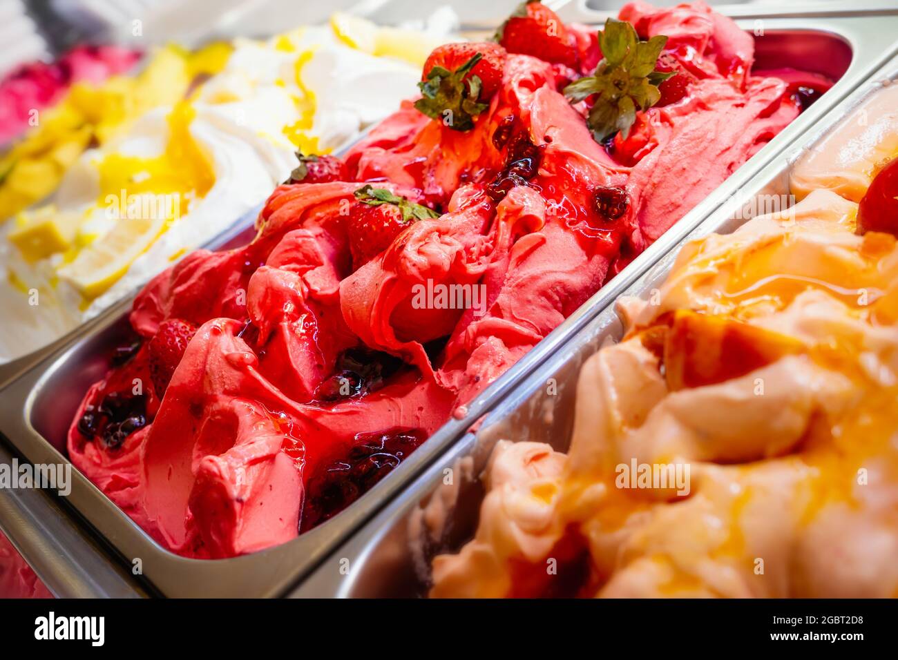 Various Gelato in a store window. Multicolor Ice cream rack in a snack