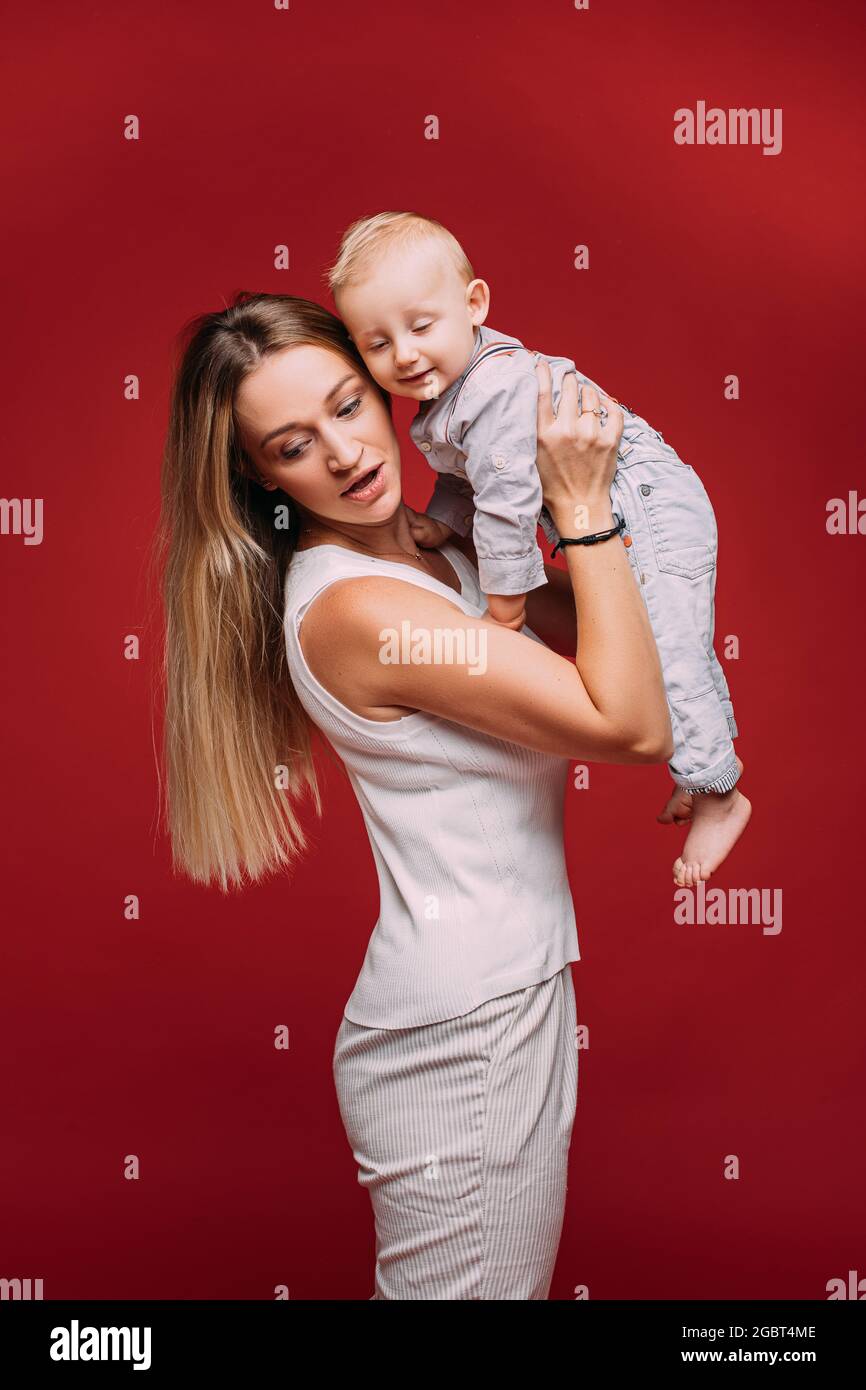 Mother holding child arms hi-res stock photography and images - Alamy