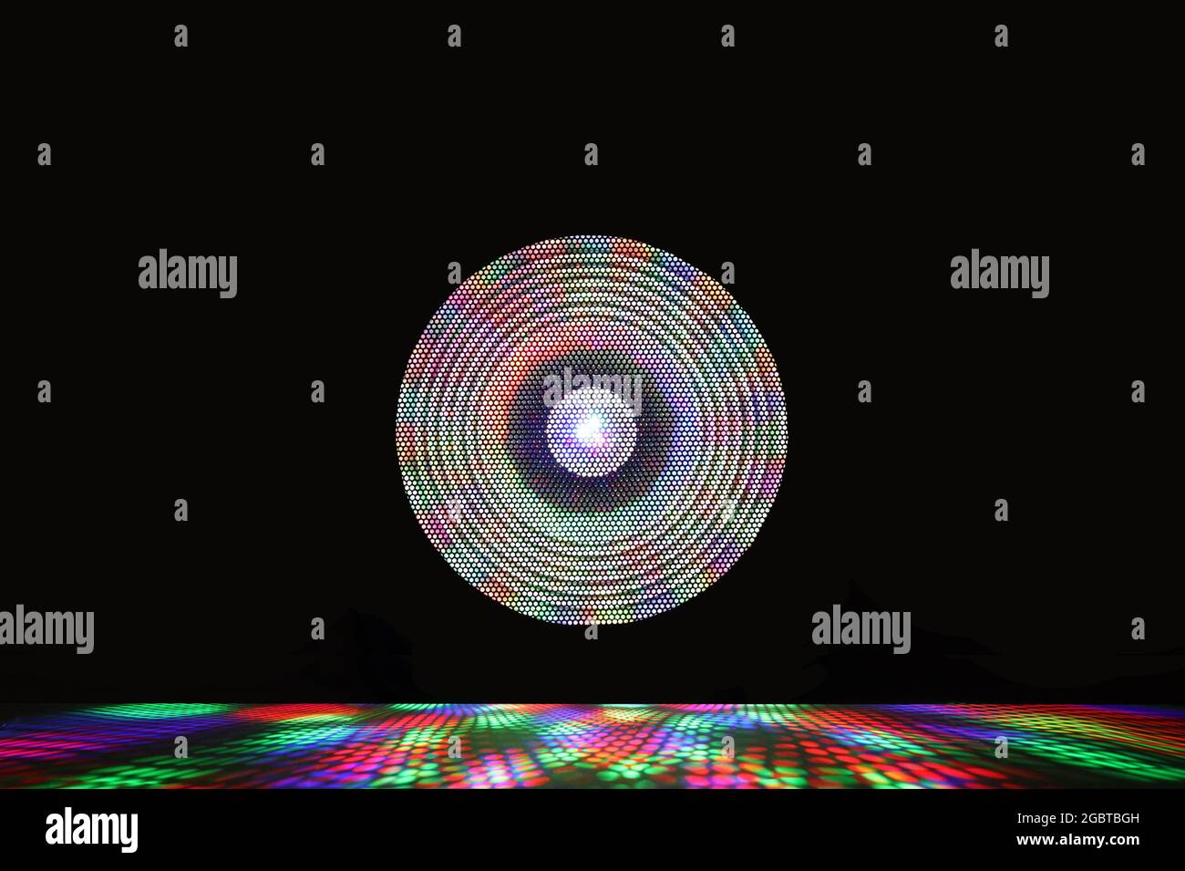 Projecto Rays Colorful spotlight with a shiny projector of light rays on a black ...