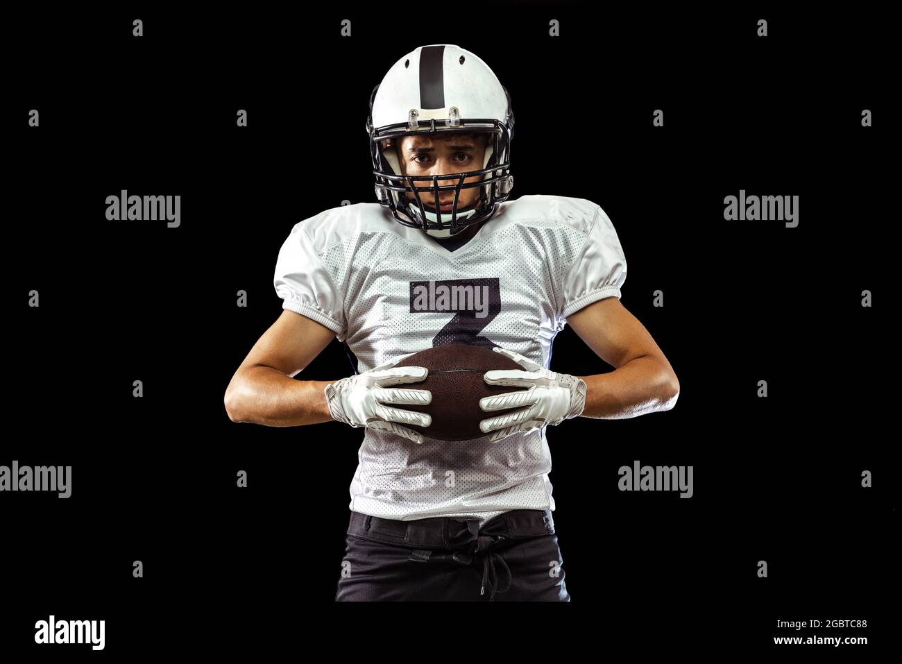 Close Up Portrait Of American Football Player In Sports Equipment Helmet And Gloves Isolated On Dark Studio Background Concept Of Sport Competition Stock Photo Alamy