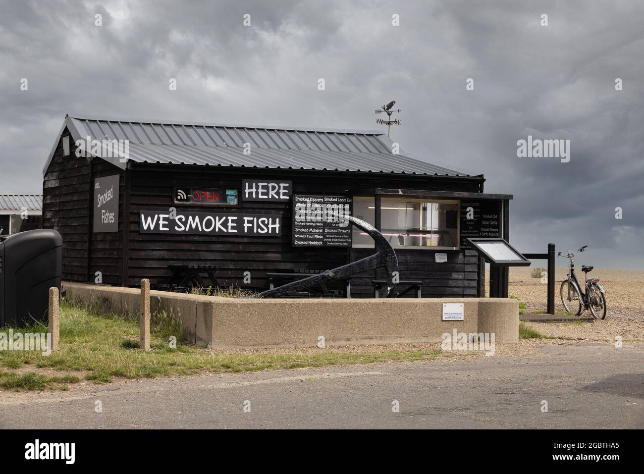 Fish smokehouse or smokery for smoking fish on the beach at Aldeburgh, Suffolk UK Stock Photo