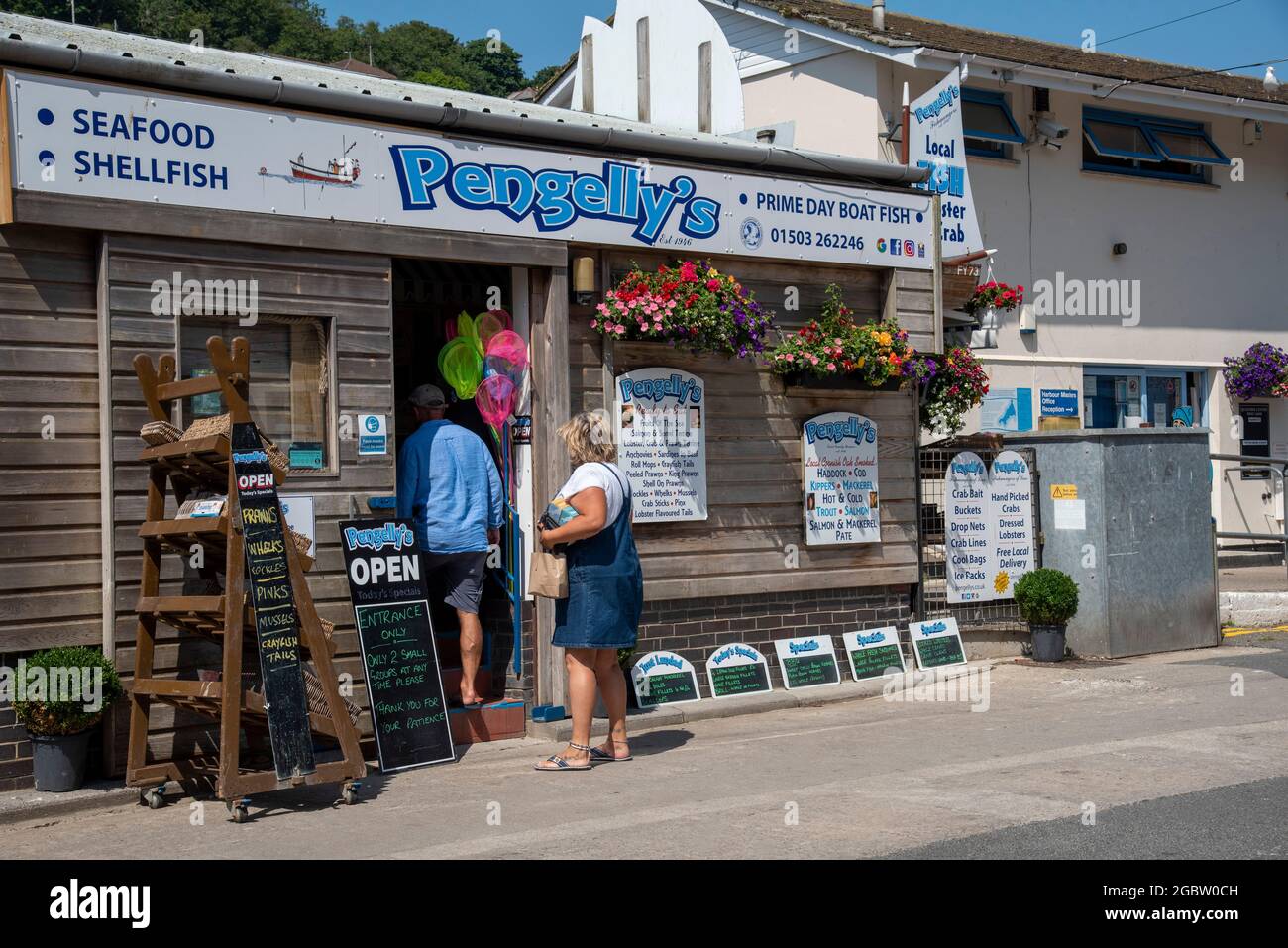 Looe, Cornwall, England, UK. 2021. Pengelly's famous fresh fish shop on the waterfront in Looe a