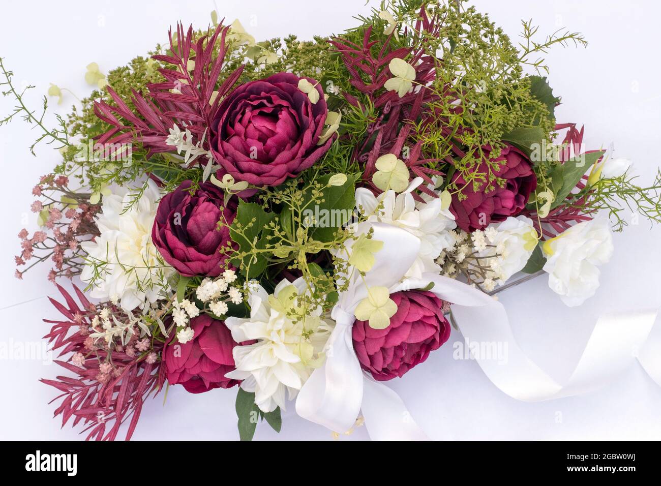 wedding bouquet on the car with ribbon on a white background Stock Photo