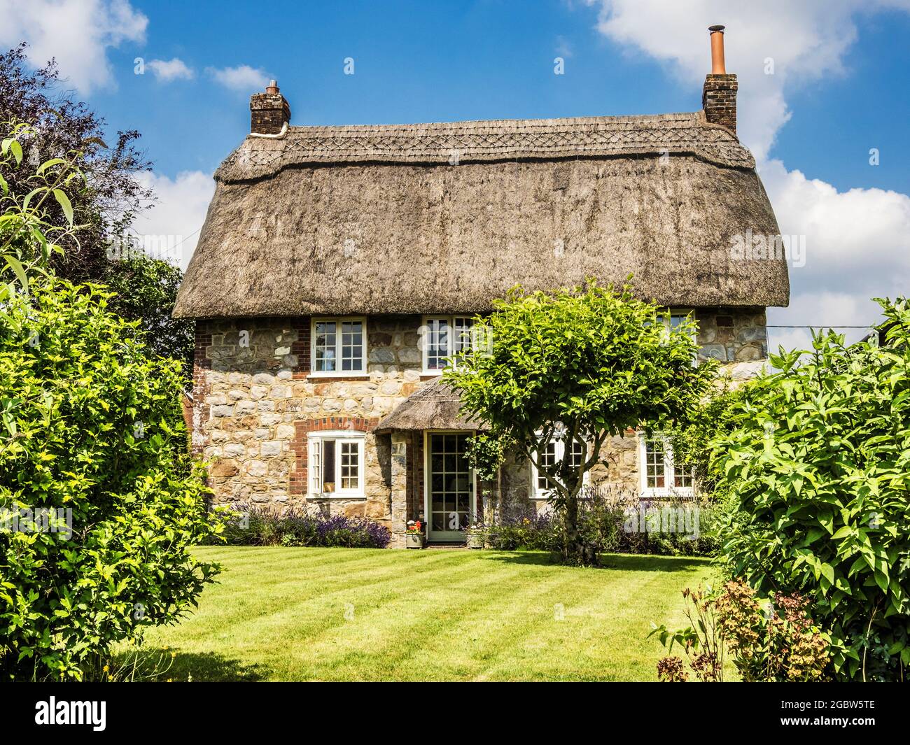 The picturesque thatched cottage in Wiltshire. Stock Photo