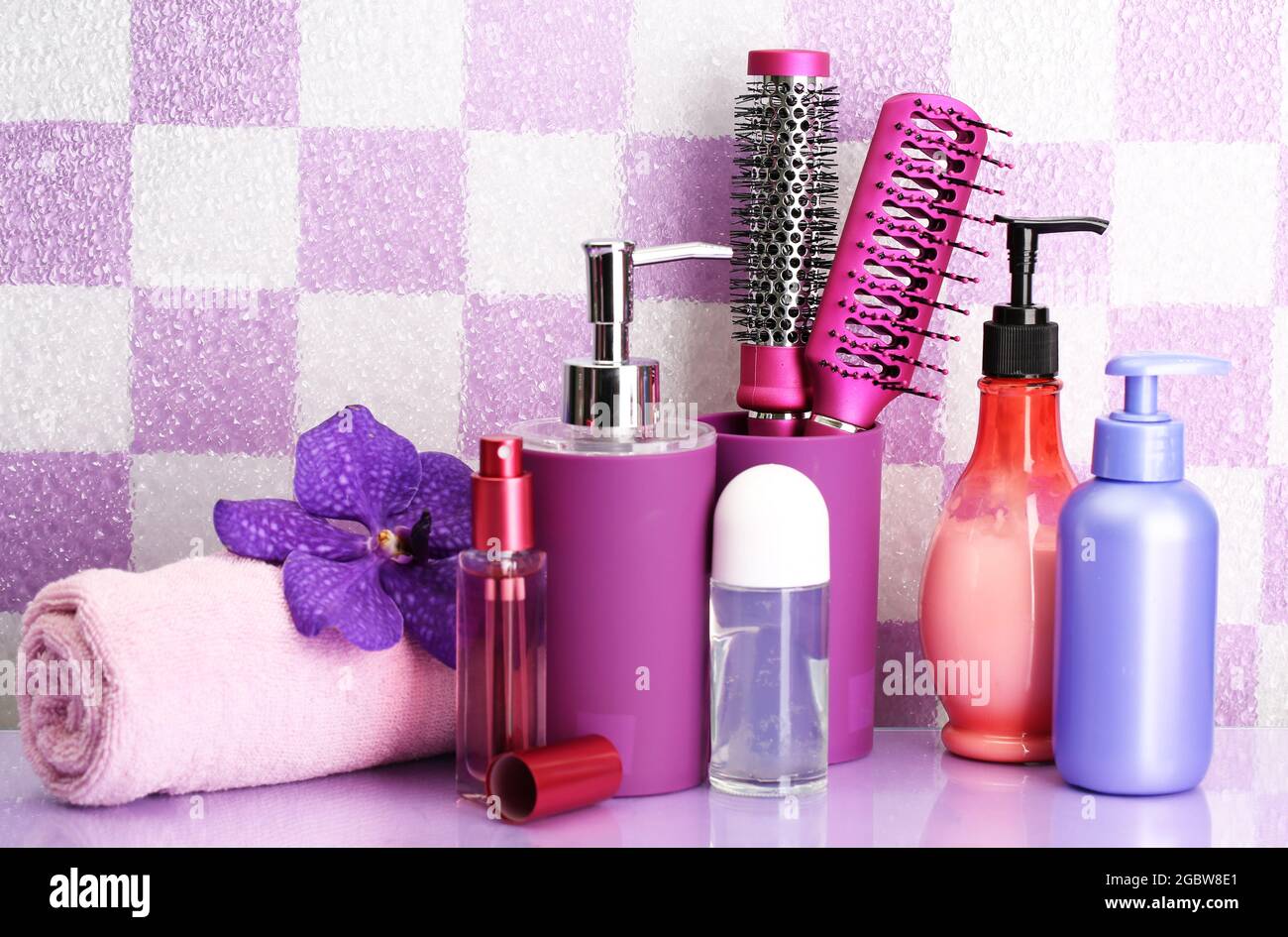 Hair brushes and cosmetic bottles in bathroom Stock Photo Alamy
