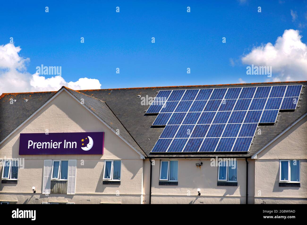 Solar panels on the roof of the Premier Inn at Sutton Harbour in Plymouth, Devon, UK. Stock Photo
