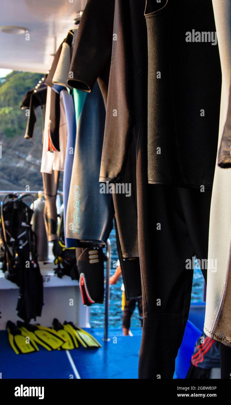 Wetsuits drying on diveboat, Similan Islands, Andaman Sea, Thailand