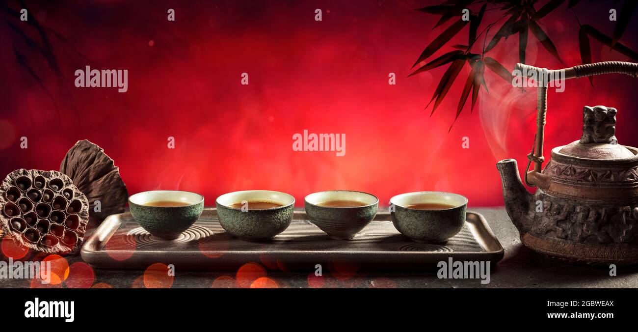 Tea Japanese Ceremony With Hot Teapot And Teacups On Red Background Stock Photo Alamy