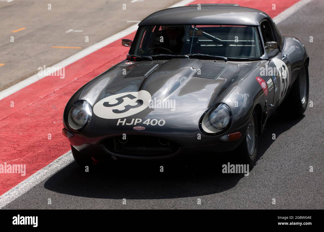 The Grey, Jaguar E-Type of John and Gary Pearson   in the pit lane before the start of the International Trophy For Classic Pre-66 GT Car Stock Photo