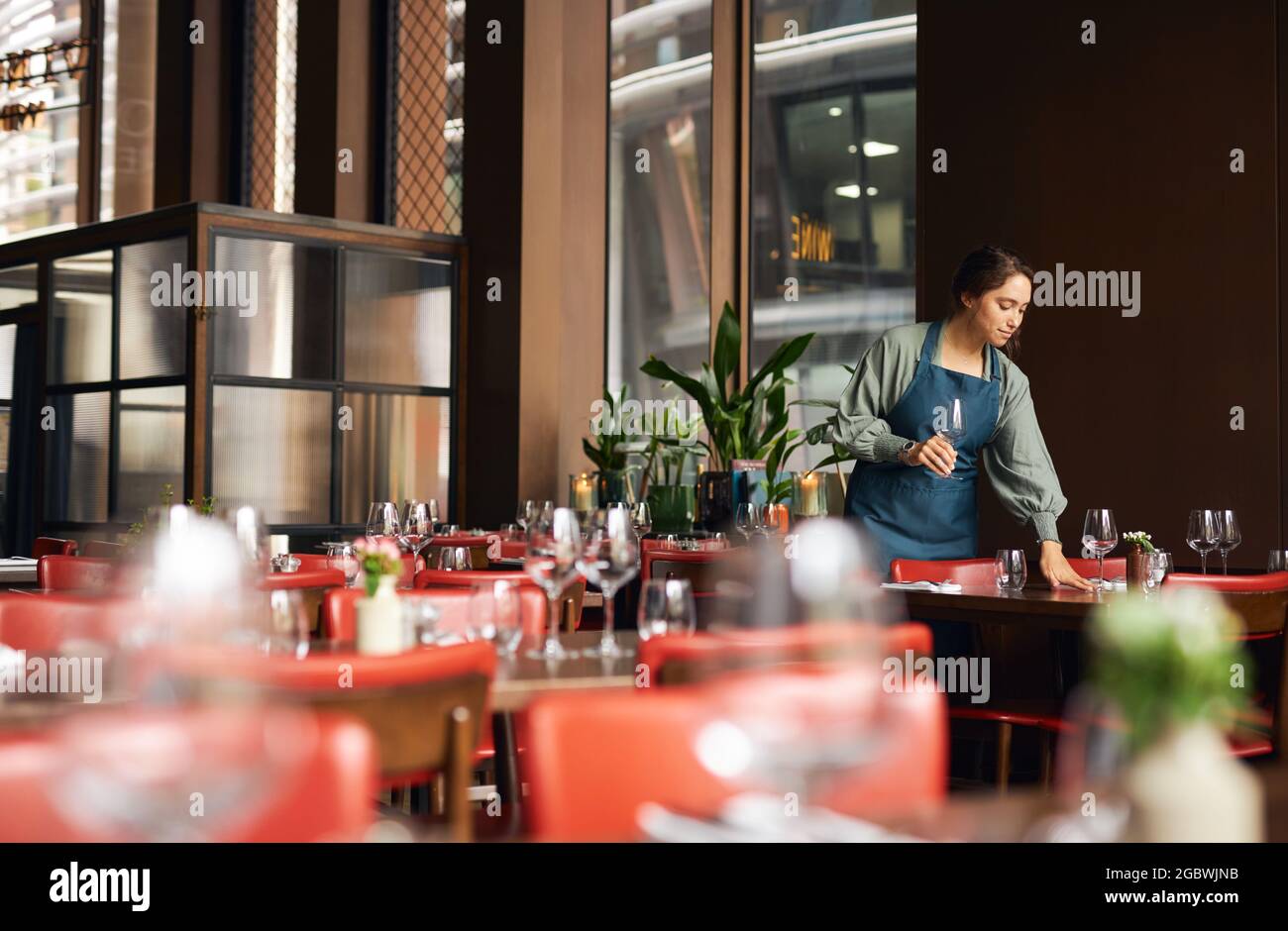 Female waitress setting tables Stock Photo Alamy