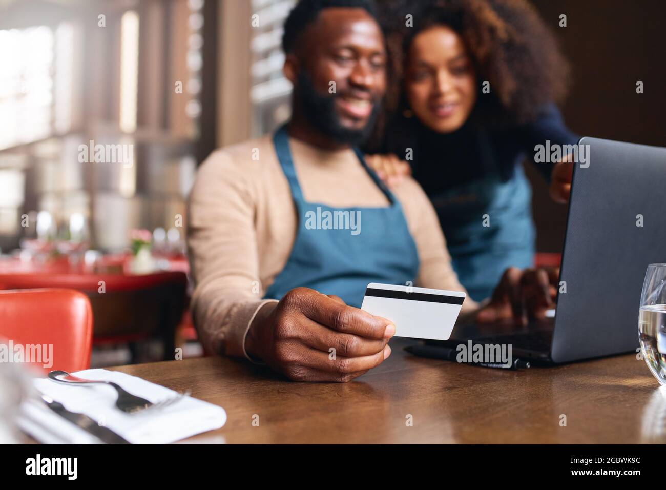Restaurant owners working on finances Stock Photo Alamy