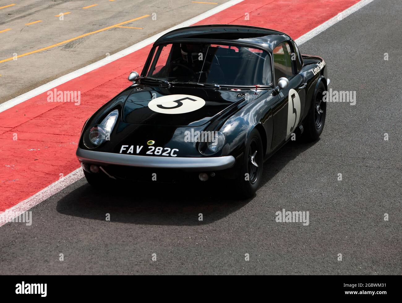 The Lotus Elan 26R, of Stephan Joebstl and Andy Willis, in the pit lane before the start of the International Trophy For Classic Pre-66 GT Cars Stock Photo