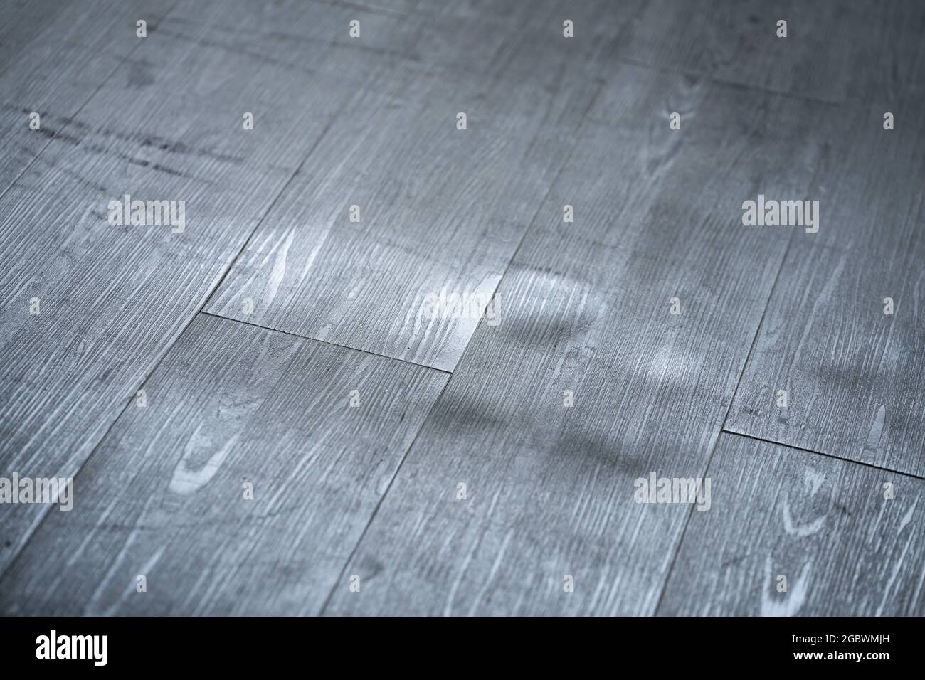 Damaged Wooden Floor. Laminate Scratch. Broken Vinyl Flooring Stock Photo
