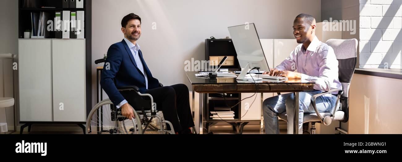 African American Handicapped Man Employee. People In Wheel Chair Stock Photo