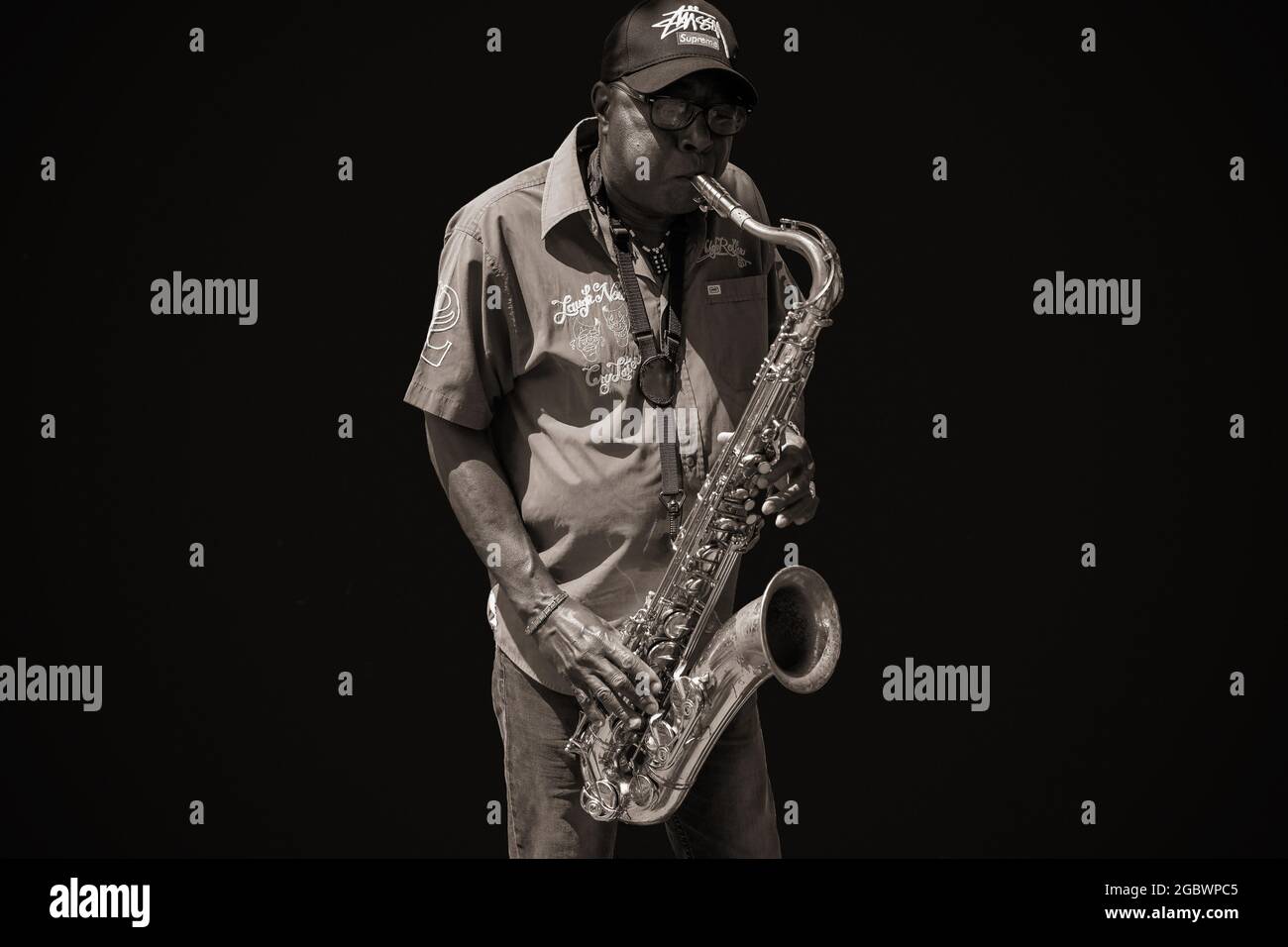 Jazz musician playing saxophone Stock Photo - Alamy