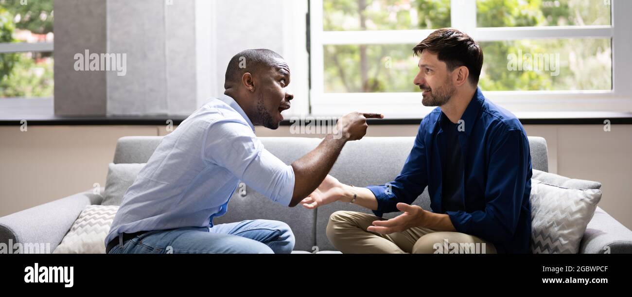 Gay Couple Fighting Each Other. Frustrated Men Arguing Stock Photo