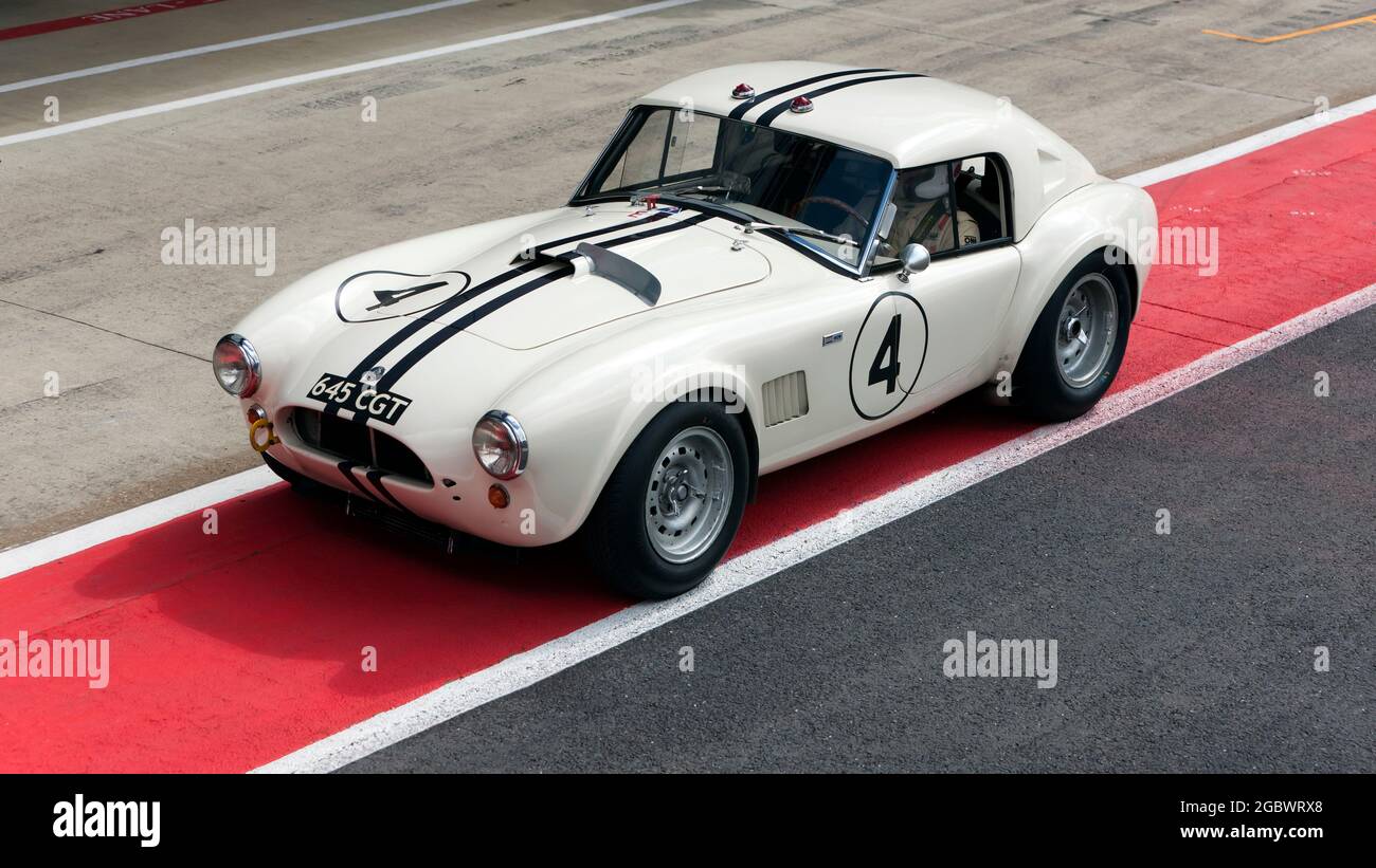 The Shelby Cobra of Richard Wilson and Gary Pearson, in the pit lane before the start of the International Trophy For Classic Pre-66 GT Cars Stock Photo