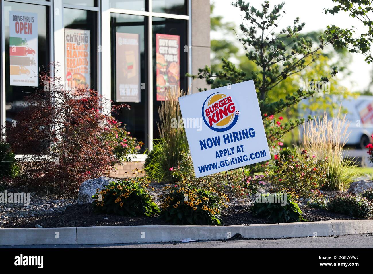 A now hiring sign seen at Burger King restaurant Stock Photo - Alamy