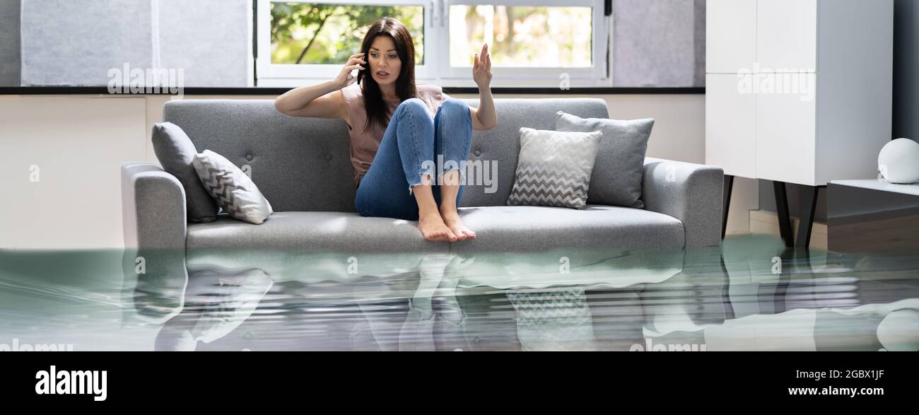 Emergency House Flood And Leakage In Living Room Stock Photo