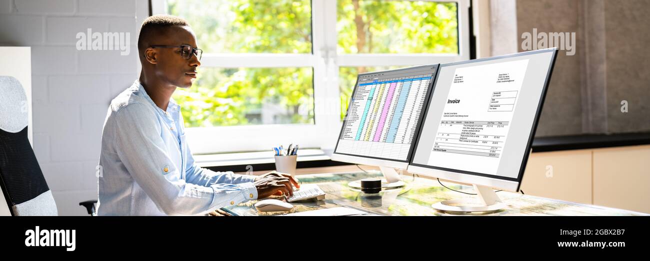 Tax Account Invoice Spreadsheet Report On Computer Monitor Stock Photo