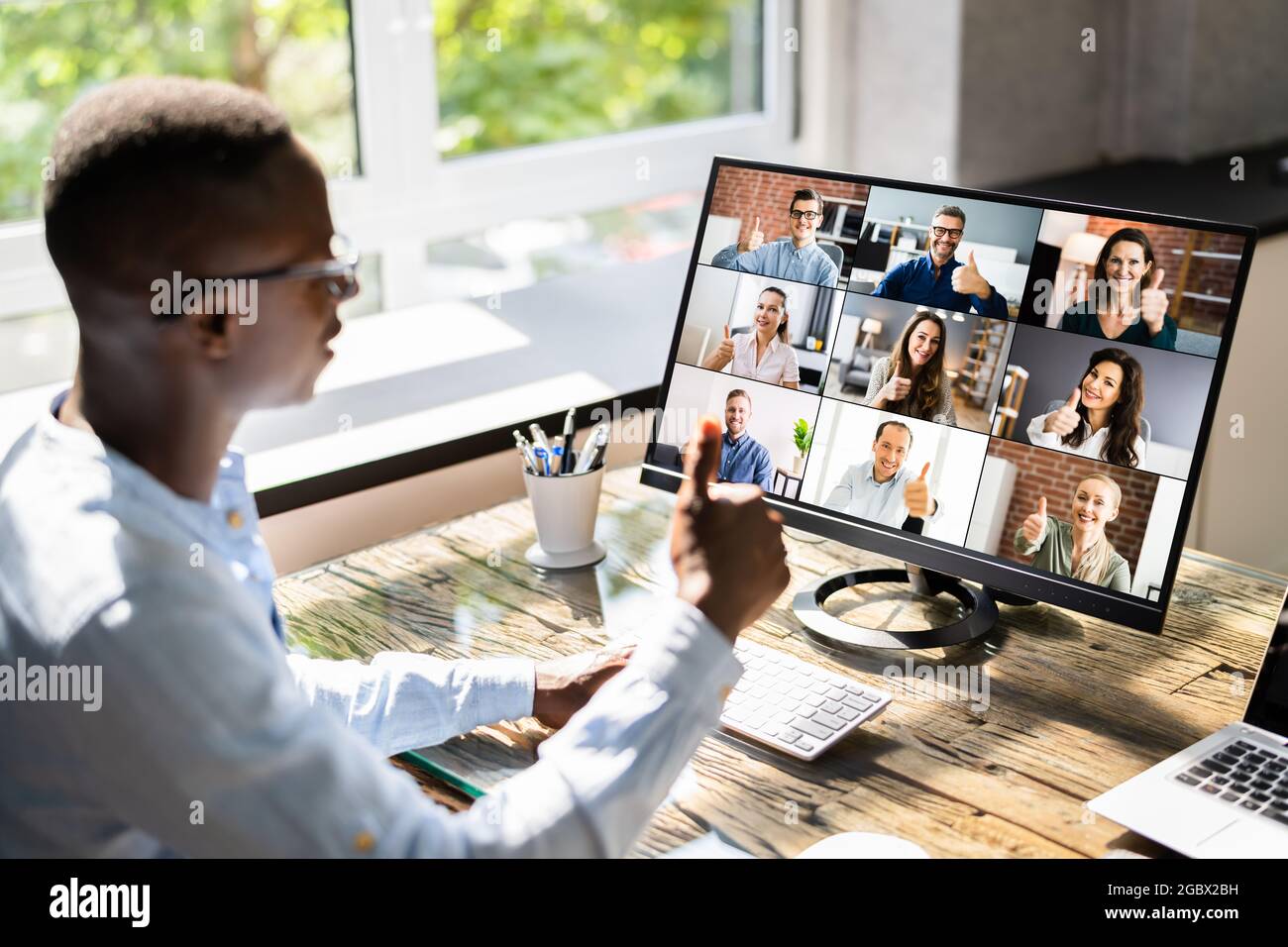 Video Conference Webinar Call On Business Laptop Thumbs Up Stock Photo