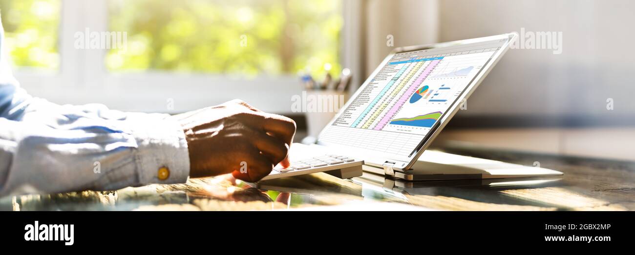 Spreadsheet Data On Hybrid Laptop Screen. Digital Financial Technology Stock Photo