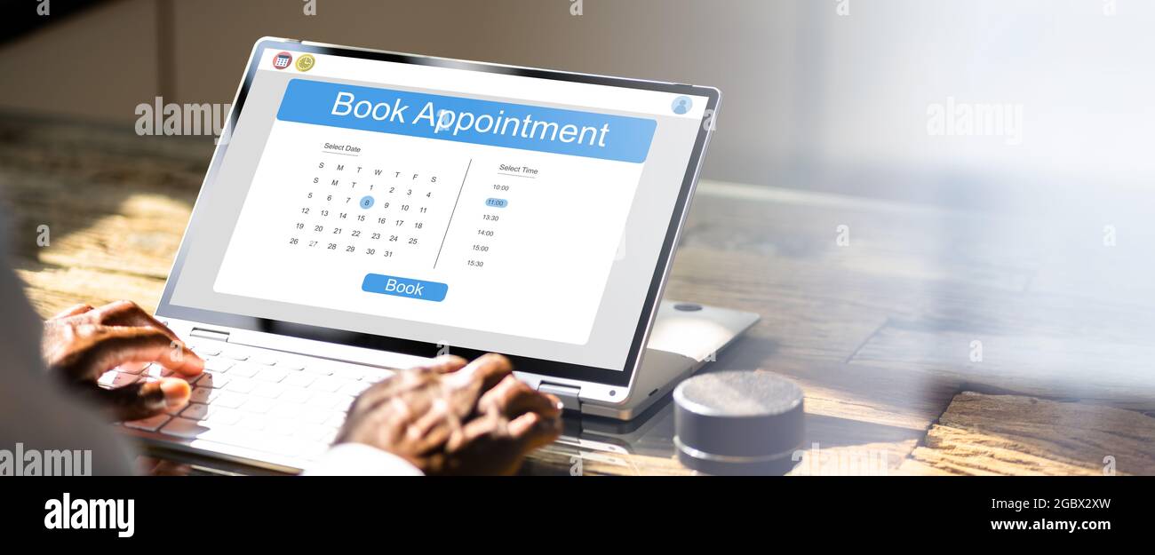 Scheduling Online Appointment On Laptop. Booking Meeting Stock Photo