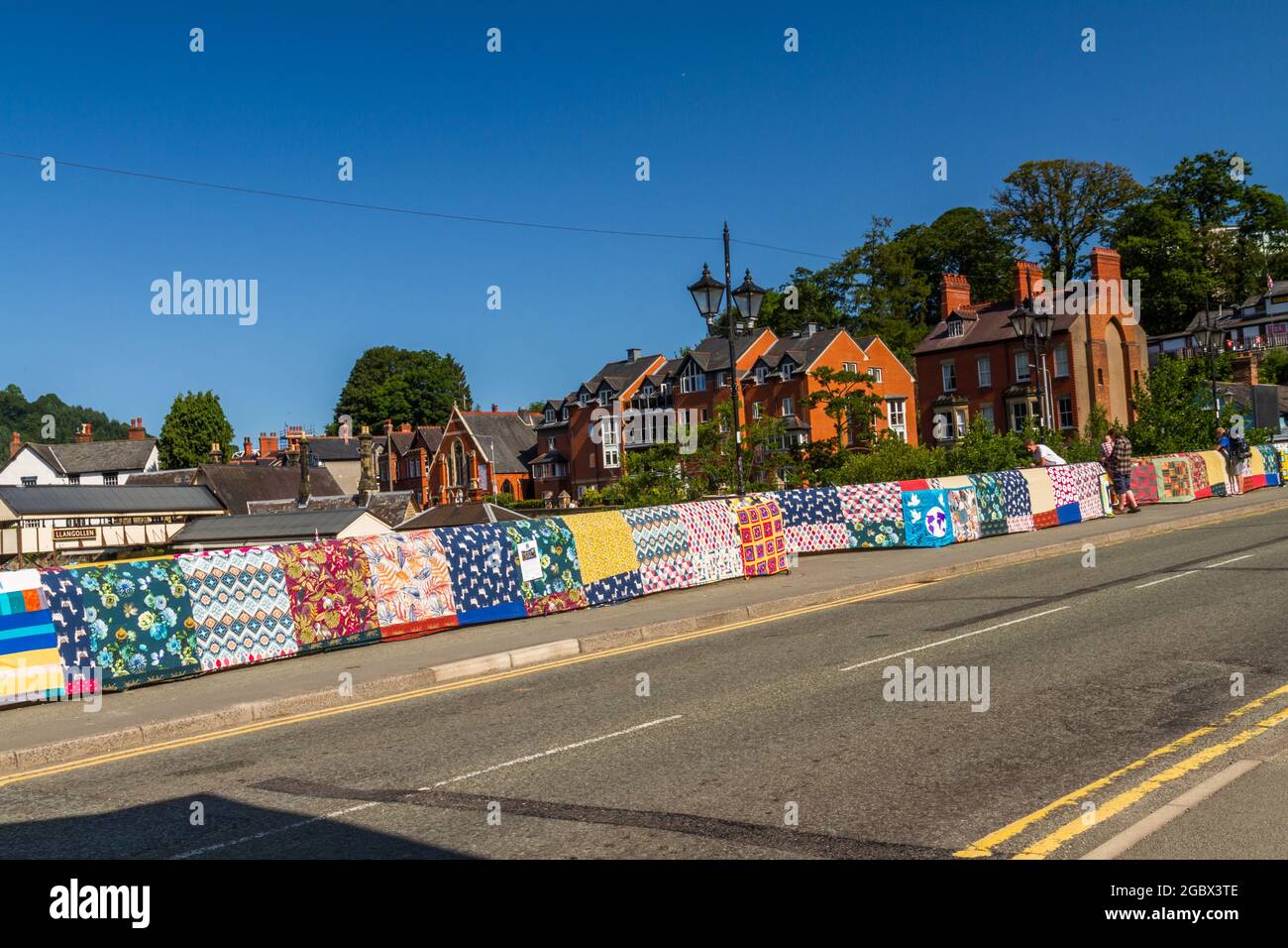 LLANGOLLEN, WALES – JULY 17 2021: Bridges Not Walls, Tapestry arts installation on bridge over River Dee by Luke Jerram to launch 2021 International M Stock Photo