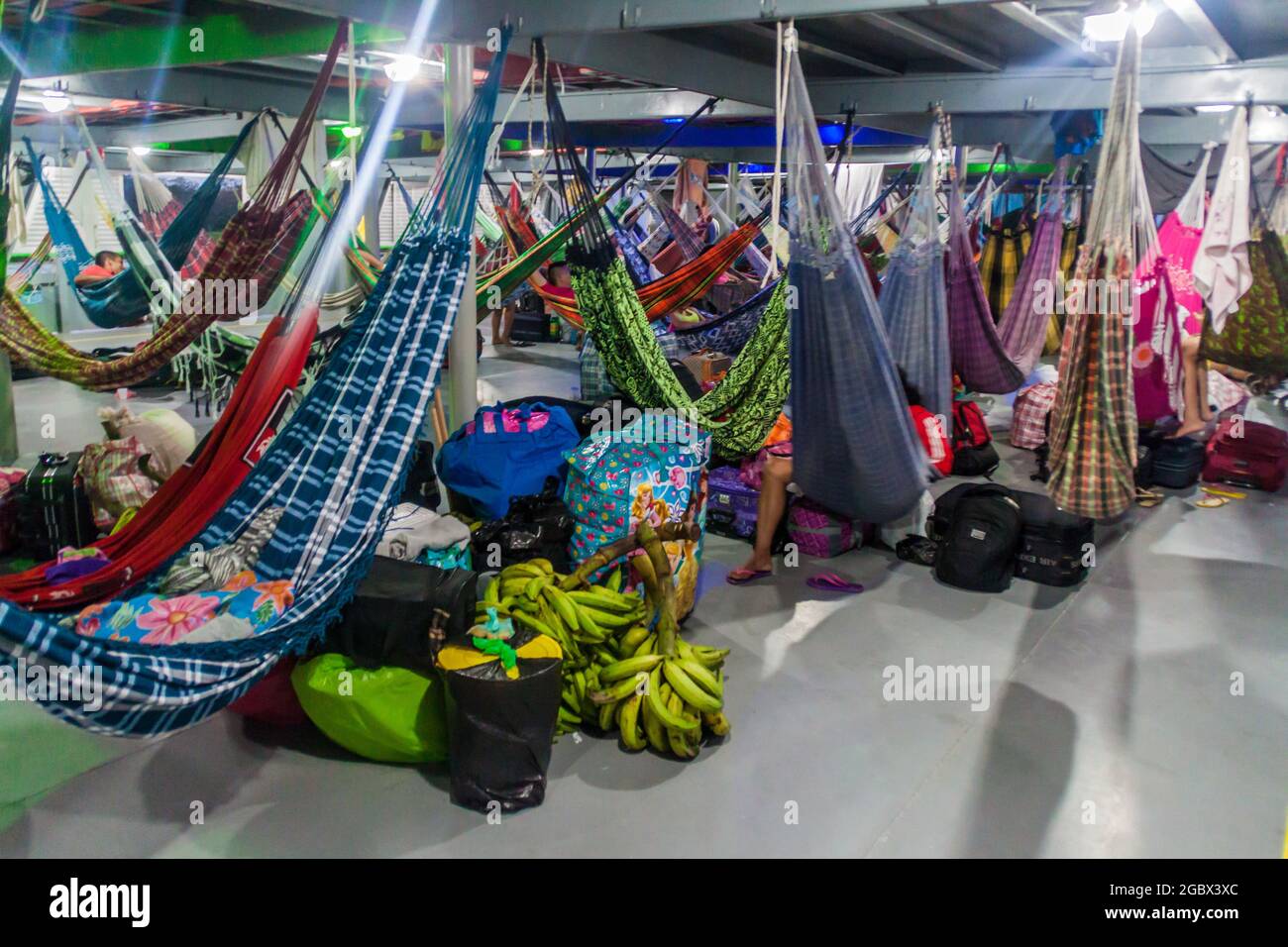 AMAZON, BRAZIL - JUNE 22, 2015: Passengers of hammock deck at the boat Diamante which plies river Amazon between Tabatinga and Manaus, Brazil. Stock Photo