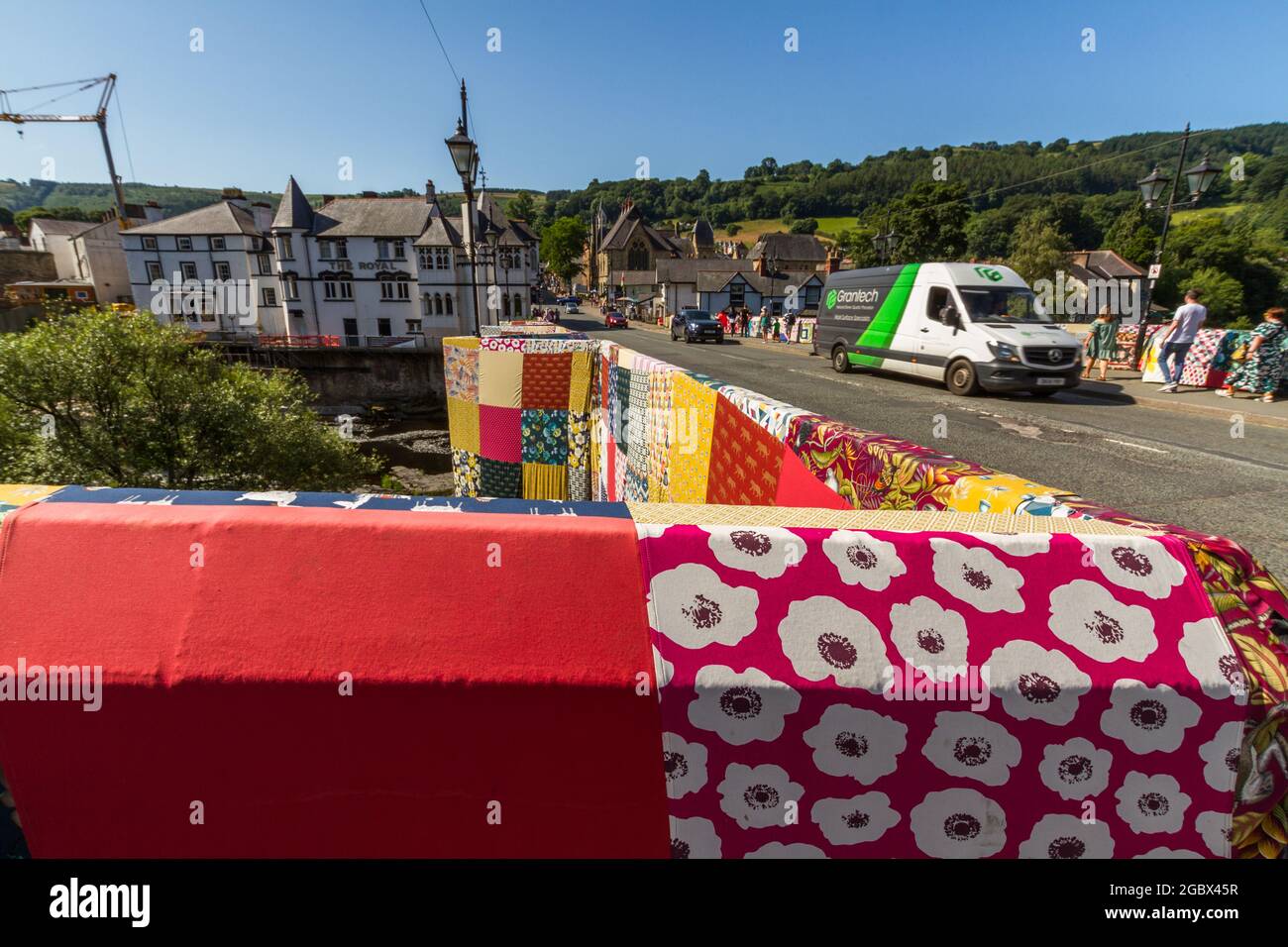 LLANGOLLEN, WALES – JULY 17 2021: Bridges Not Walls, Tapestry arts installation on bridge over River Dee by Luke Jerram to launch 2021 International M Stock Photo