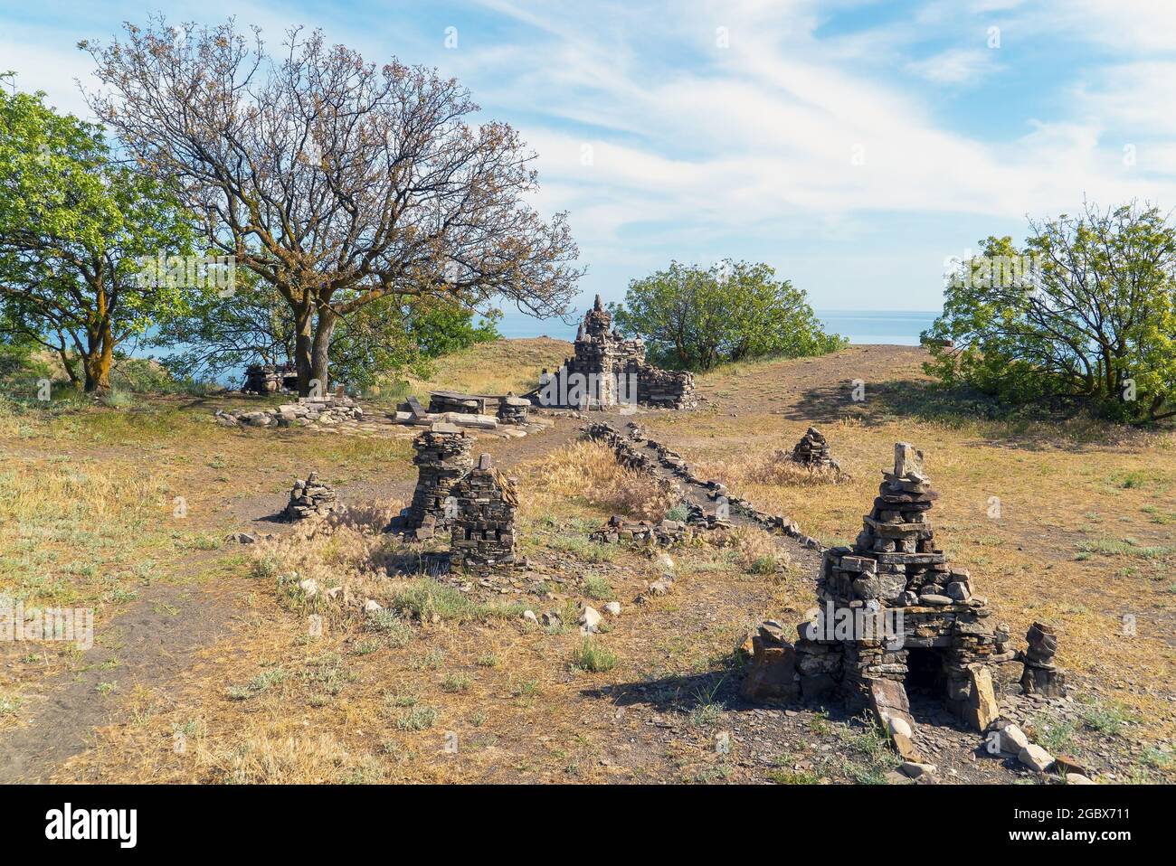 Sculptural composition of stones in a clearing by the sea . Choban-kule. Crimea Stock Photo