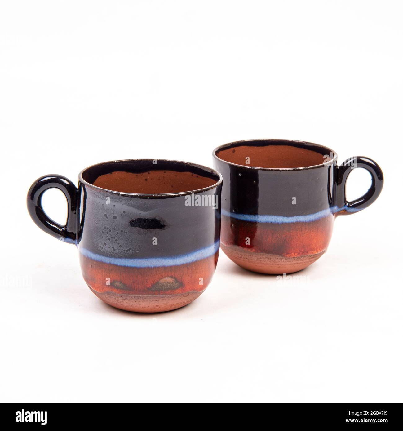 handmade ceramic coffee mugs isolated on white background Stock Photo