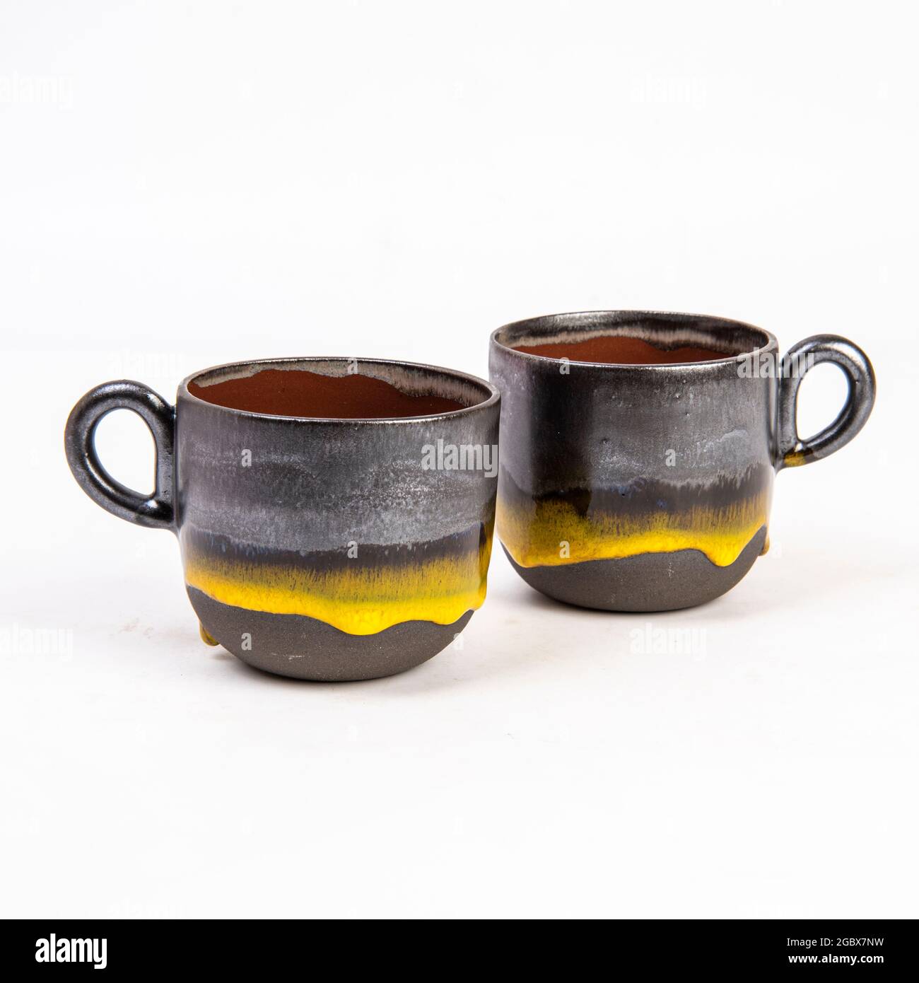 https://c8.alamy.com/comp/2GBX7NW/handmade-ceramic-coffee-mugs-isolated-on-white-background-2GBX7NW.jpg