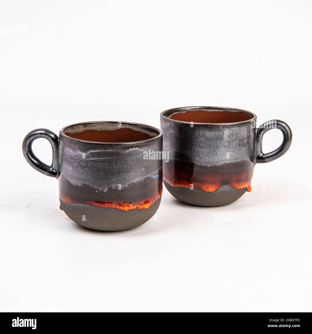 handmade ceramic coffee mugs isolated on white background Stock Photo