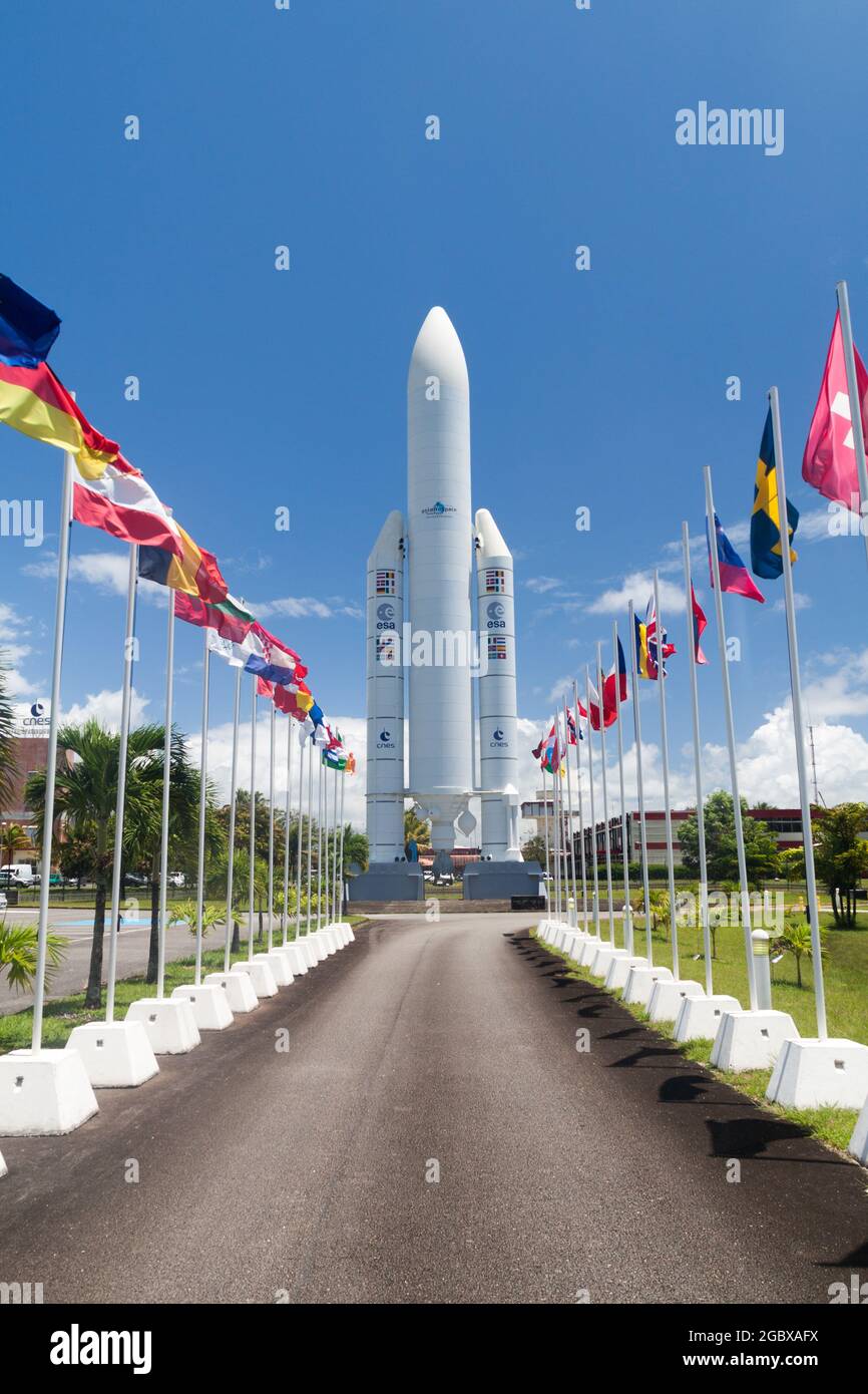 KOUROU, FRENCH GUIANA - AUGUST 4, 2015: Model of Ariane 5  space rocket and flags of ESA members at Centre Spatial Guyanais (Guiana Space Centre) in K Stock Photo